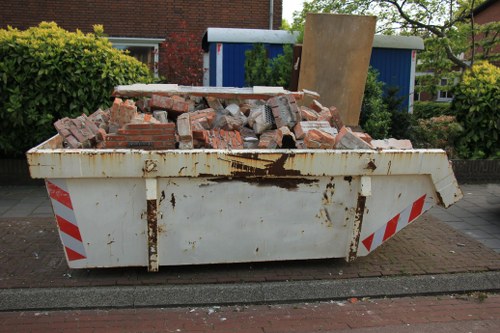 Construction site with builders waste bins in Seven Sisters